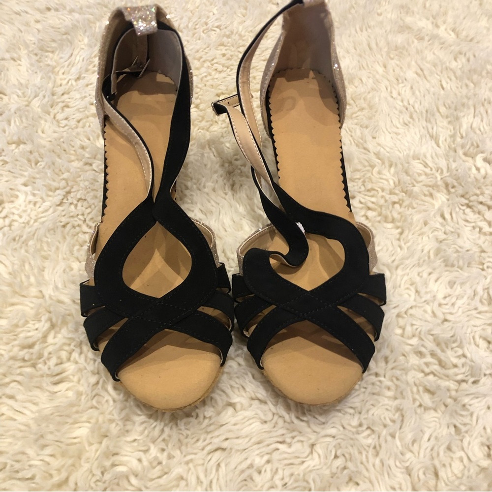 NWOT Black with shinny gold dancing shoes
Size 10 but feels more like a size 9